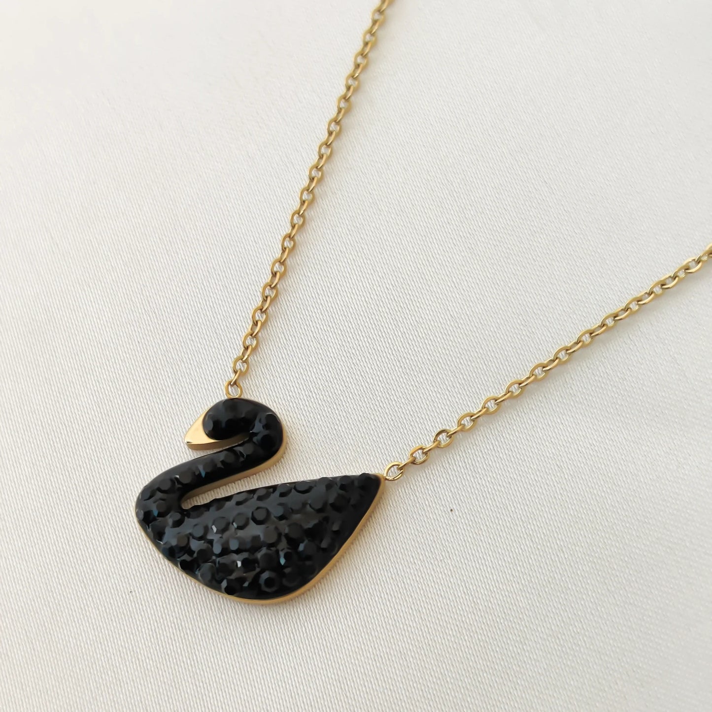 ZARAHE Midnight Swan Necklace – Black & Gold Charm